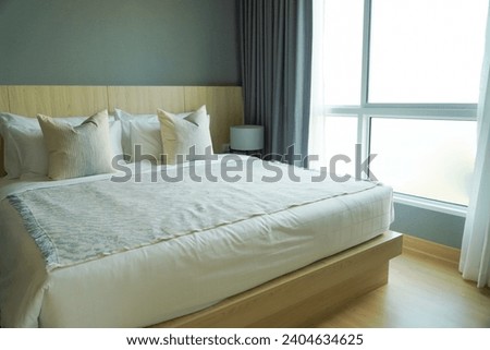 comfortable pillow on bed decoration in bedroom interior with light from window,Natural light. Clean decor.