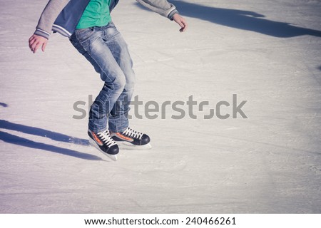 Image of teenager who are ice skating in the ice rink at the Medeo