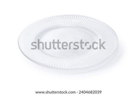 Glass plates placed on a white background.  Royalty-Free Stock Photo #2404682039