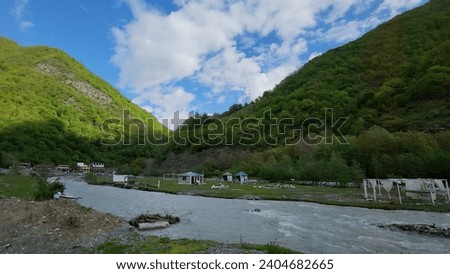 Gorgia Tbilisi Gudauri Road river with water and Natural scenery Great Views blue sky and clouds  mountain trees  Red Yellow flower green leaf land screen background wallpapers HD travel and holidays