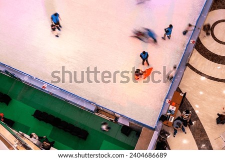 slow shutter photos give the impression of movement - an ice skating rink with a view from above