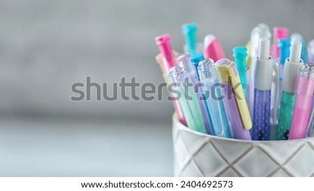 Pens are versatile writing instruments that come in various shapes, sizes, and colors Royalty-Free Stock Photo #2404692573