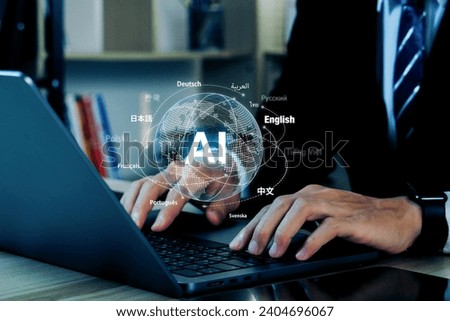Ai translate language concept.Businessman hand with ai translator with blue background, Artificial intelligence chatbot equipped with a Language model technology. Royalty-Free Stock Photo #2404696067