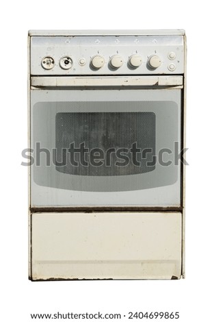 Old gas stove isolated on white background. Recycling of household appliances. Royalty-Free Stock Photo #2404699865