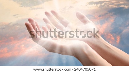 Closeup sacred young teen saint holy israel jew lady hold open cup palm beg wish help give bless divine love Lord life. Old biblic arab male guy boy sin soul spirit thank grace day ray beam text space Royalty-Free Stock Photo #2404705071