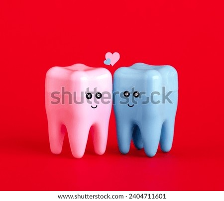 Cute blue and pink tooth on red background. St Valentine's day card.