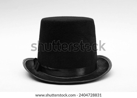 One magician top hat on white background Royalty-Free Stock Photo #2404728831