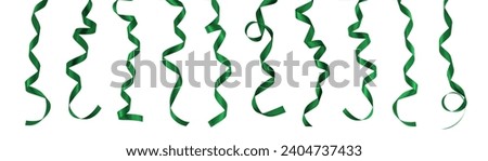 Green ribbon satin scroll confetti hanging bow set isolated on white background with clipping path for Christmas holiday and greeting card design decoration 