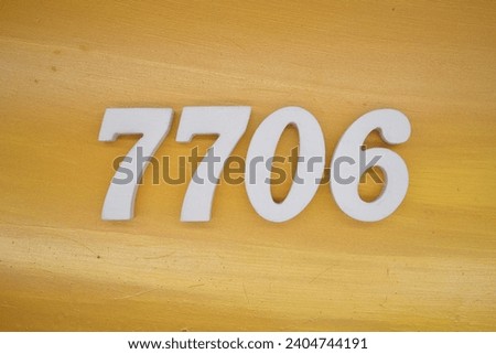 The golden yellow painted wood panel for the background, number 7706, is made from white painted wood.