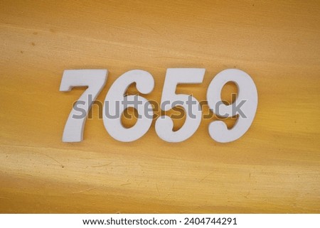 The golden yellow painted wood panel for the background, number 7659, is made from white painted wood.