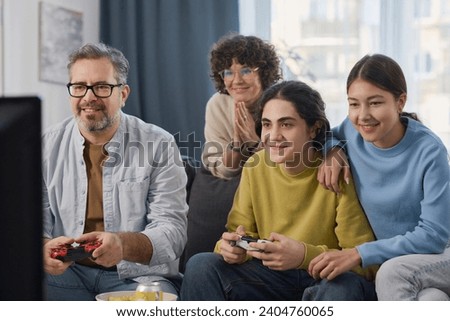 Family playing video games together