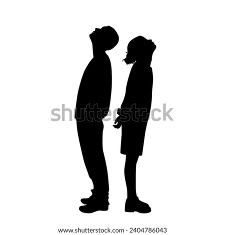 Vector silhouettes of a man and a woman, a couple of business people standing in profile, looking up, black color on a white background Royalty-Free Stock Photo #2404786043