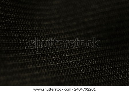 Photo of black background, black mesh, black stripes from fabric.