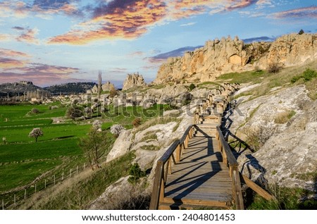 Historical ancient Frig vadisi (Phrygia, Gordion)  Valley. Monuments, houses, structures,  carved into  rocks. Frig Valley is popular tourist attracti Royalty-Free Stock Photo #2404801453