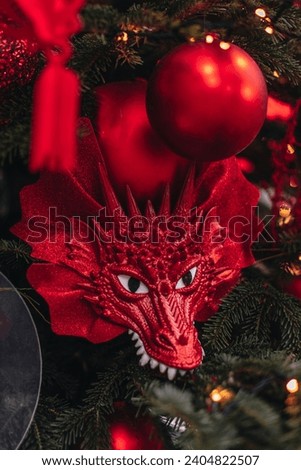 Christmas tree decorated with red dragon in Chinese style, traditional New Year decorations