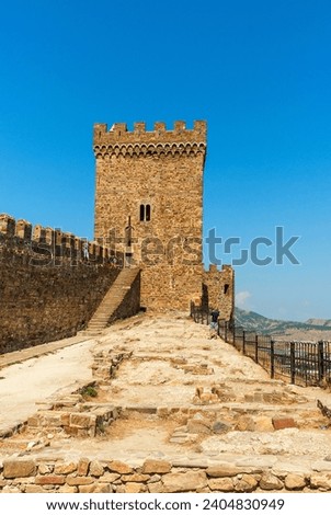 Fortress in Sudak. Historical stronghold overlooking the sea, a testament to architectural heritage and coastal beauty. Royalty-Free Stock Photo #2404830949
