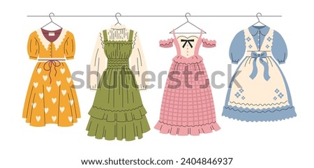 A set of cute women's dresses with ruffles and lace. cottage core fashion. Vintage, retro. Vector, flat, cartoon illustration Royalty-Free Stock Photo #2404846937