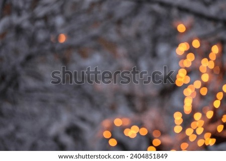 Blurred photo with bokeh of garden lights in a wintry Sweden. Suitable as a background image. GoranOfSweden