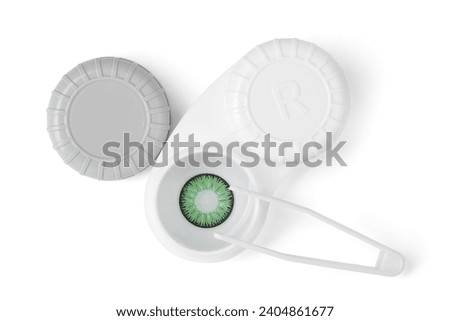 Case with green contact lenses and tweezers isolated on white, top view Royalty-Free Stock Photo #2404861677