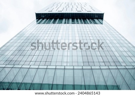 Glass-covered tall building disappears into the sky