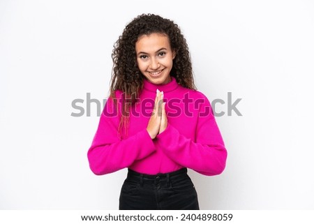 Young Arab woman isolated on white background keeps palm together. Person asks for something