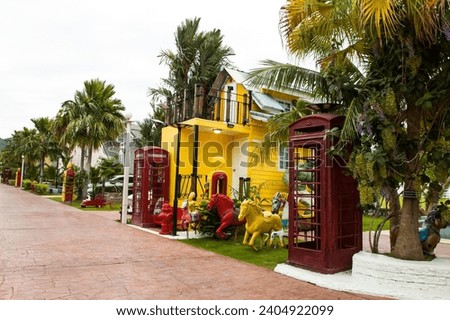 The bungalows are colorful and cartoon-patterned.