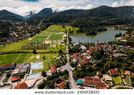Aerial drone view of the city of Granja Comary in Teresopolis, the headquarters and main training center of the Brazil national football team Royalty-Free Stock Photo #2404928035