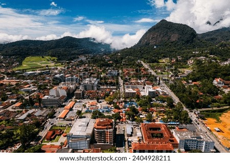 Aerial drone view of the city of Teresopolis in the mountainous region of Rio de Janeiro, Brazil. The city has a population of 184k and is home to the Brazilian national football team training place Royalty-Free Stock Photo #2404928211