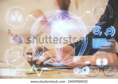 Double exposure of woman hands typing on computer and general theme hologram drawing. Education concept.
