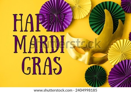 Mardi Gras.Colorful group of Mardi Gras or venetian mask on yellow,Mardi gras carnival decoration beads yellow background	