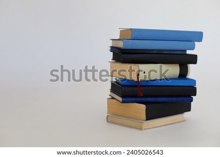 Blue and black books on white