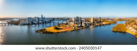 Modern high-rise suburb of Rhodes on waterfront of Parramatta river in Sydney west aerial cityscape panorama. Royalty-Free Stock Photo #2405030147