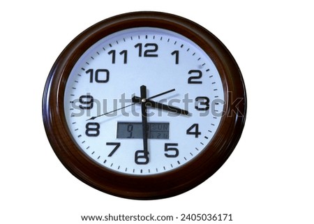 Round wall clock.The minute and second hands.An electronic watch.They show the time of day.on a white isolated background. in a wooden frame