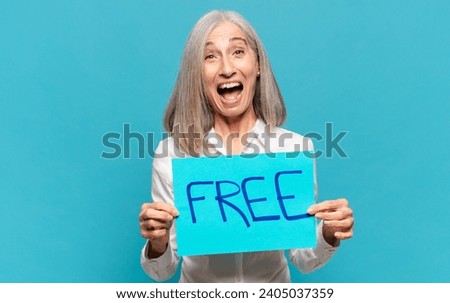 middle age woman holding a placard with a concept 