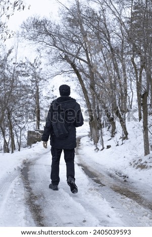 Nature photographer shooting in winter landscape
