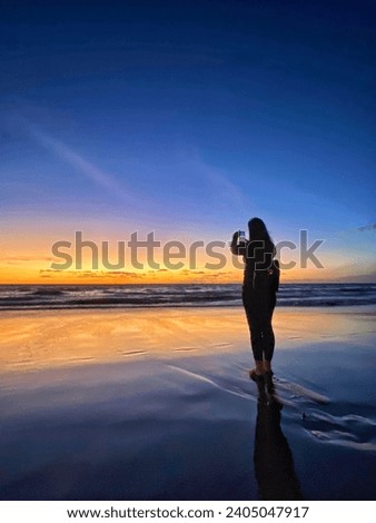 taking sunset picture in the beach