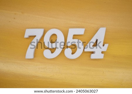 The golden yellow painted wood panel for the background, number 7954, is made from white painted wood.