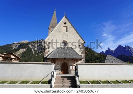 Small church in St. Magdalena or Santa Maddalena in Geislergruppe or Gruppo dele Odle Italian Dolomites Alps mountains Royalty-Free Stock Photo #2405069677
