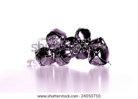 Silver shiny bells in a group on white background