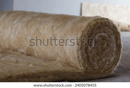 Insulating the house with mineral wool. Insulation Royalty-Free Stock Photo #2405078455