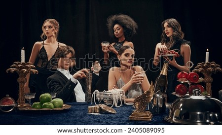 Family gathering. Young man and woman in elegant clothes meeting for luxurious dinner, celebrating events, holidays, Christmas. Concept of upper-class, holidays, party, royalty