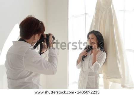 Photographer taking pictures of bride and groom in wedding ceremony, Love ,Romantic and wedding proposal concept.