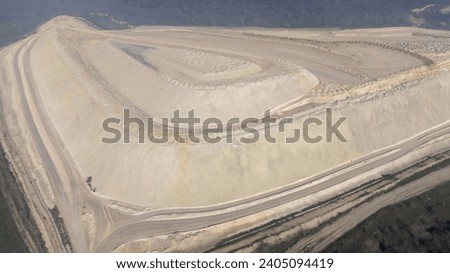 Aerial view of a surface tailings pond of chemical residue. Tailings pond for waste from a chemical plant Royalty-Free Stock Photo #2405094419