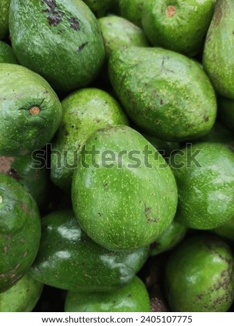 Creamy and nutritious avocado, a green delight with a smooth texture. Versatile for healthy dishes and vibrant visuals. Rich in flavor, perfect for various creative desig Royalty-Free Stock Photo #2405107775