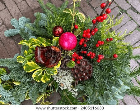 Winter decor. Beautiful flower arrangement of natural spruce branches, cones for festive decorating the house