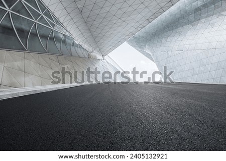 Empty asphalt and building structure frame