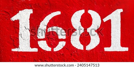 Weathered numbers one, six, eight, 1681, or 1, 6, 1 painted white on a piece of red metal. Abstarct numeral background for design. Royalty-Free Stock Photo #2405147513
