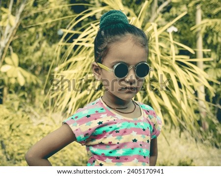 AI photo filter effect of little cute girl with wearing black eyeglass in park.