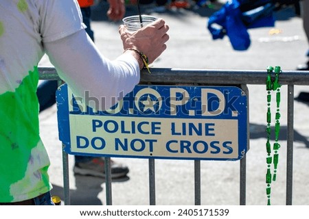 New Orleans Police Department - Police Line Do Not Cross sign for Mardi Gras event.