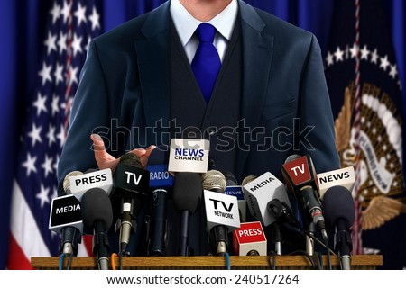 Politician at Press Conference Royalty-Free Stock Photo #240517264